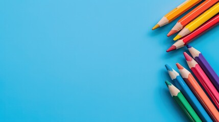 Fototapeta premium Collection of sharpened pencils on a blue background.