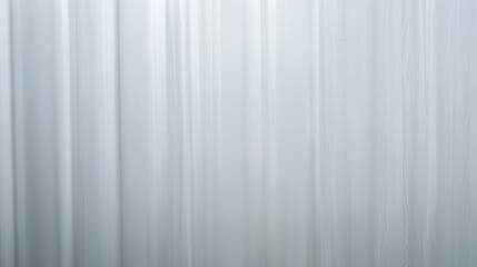 Abstract Vertical Lines:  A minimalist image featuring a series of subtle, vertical lines creating a smooth, elegant texture. Perfect for backgrounds or design elements. 
