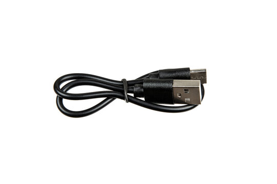 Black USB cable with USB-A and USB-C connectors, coiled neatly and isolated on white, ideal for charging and data transfer for a range of electronic devices.