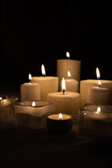 candle, candlelight, flame, light, calm, wax, serene, ambiance, background, dark, brightness, wick, glass, holder, pillar, warm, together, size, shape, group, lit, various