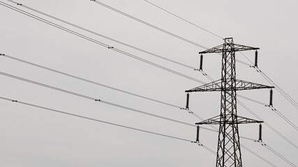 silhouette of electric metal tower