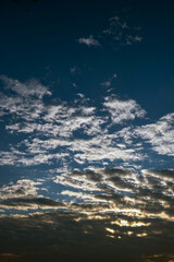 clouds at sunrise. blue sky. fluffy cirrus clouds.