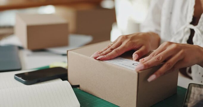 Hands, woman and sticker with box at workshop for packaging process, delivery label and online order. Person, package and inventory management, shipping information and company brand for distribution