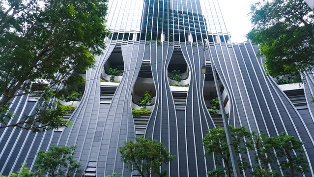 Singapore - January 20, 2025: CapitaSpring skyscraper with unique balcony with trees and plants, Designed by architectural firm BIG and Carlo Ratti