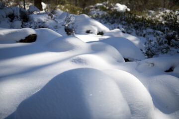 Snow covered rocks in the sunshine 