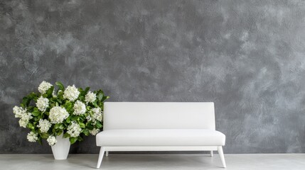 White couch and flowers against a gray wall. Interior design. Possible use showcasing modern home decor