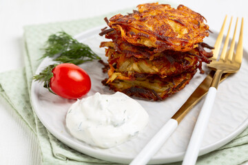Crispy Potato Pancakes with Sour Cream.