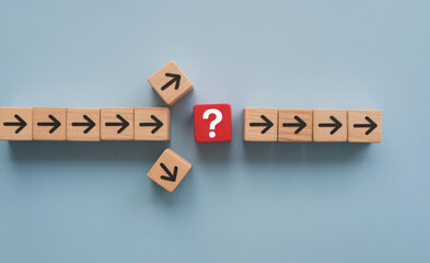 Question mark print screen on red wooden block cross in the middle of arrow for interrupt of process concept. 