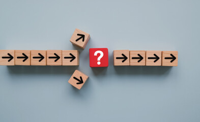 Question mark print screen on red wooden block cross in the middle of arrow for interrupt of process concept. 
