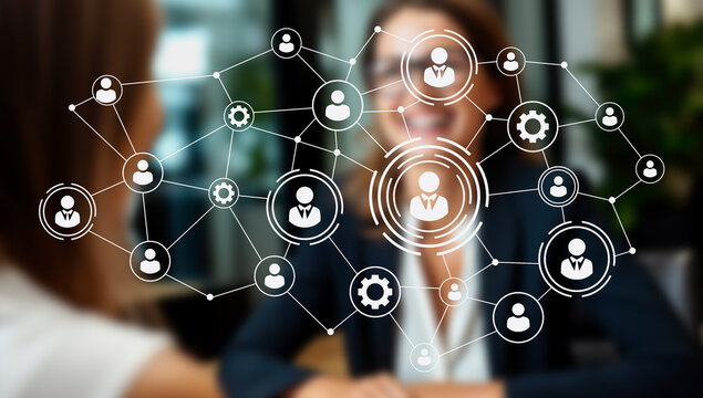 Two professionals engage in a handshake within a green cubicle setup highlighting a hybrid workflow. The space promotes agile leadership and remote automation for digital nomads