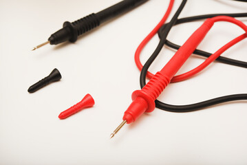 Probes for multimeter. The red and black wires of the measuring device.