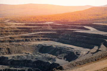 Geological Strata Layers Revealing Erosion Patterns in Rocky Terrain from open pit mine industry.
