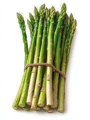 Fresh green asparagus spears tied together on white background