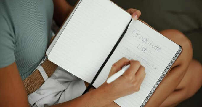 Home, woman and writing in diary for mental health, emotions growth or self care on sofa. Above, female person or gratitude with journal for reflection, information or affirmations with book in house