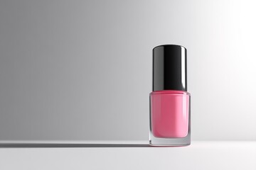 Minimalist nail polish bottle showcases a soft pink shade with a glossy black cap. Perfect for beauty applications and product display