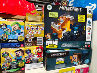 Naklejka premium Kyiv, Ukraine - February 09, 2025: Colorful display of Minecraft mini mode playsets with character toy packaging