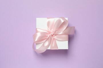 Beautiful gift box on color background