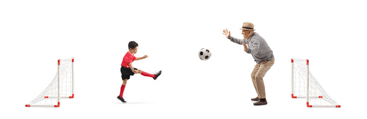 Kid playing football with a senior man