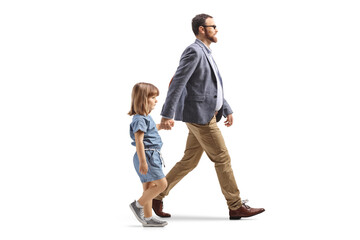 Father and daughter walking and holding hands