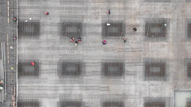 Trion venue from above. The grandiose large -scale construction, reinforcing work were removed from the top. Many workers make a reinforcing frame for monolithic structures during construction