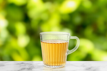 Green tea in cup on marble table outdoors