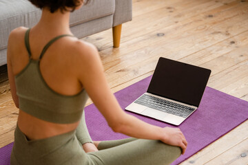 Fototapeta premium young pretty woman doing yoga at home