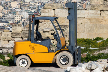 A forklift among the ruins of the ancient Acropolis in Greece.