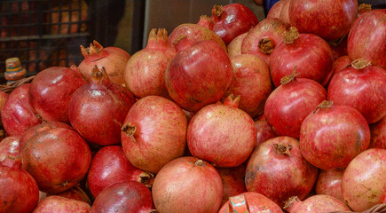 red ripe pomegranates at a stall on the streets of Taormina in Sicily