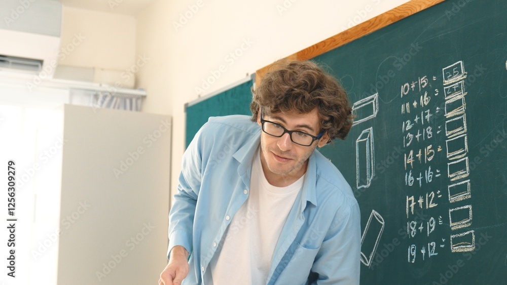 Poster caucasian teacher looking at student while standing at blackboard. low angle camera of professional 