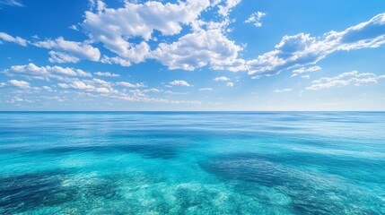 Obraz premium Capturing the Tranquility of Clear Blue Ocean and Serene Sky in Vibrant Tropical Setting