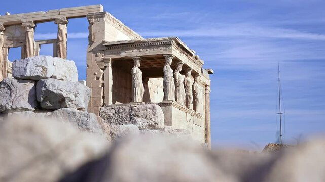 Temple of Athena Nike with columns on Acropolis hill. Ancient temple, historic landmark. Popular travel destination in Europe.