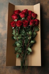 Beautiful bouquet of red roses lying on brown wrapping paper, celebrating love and romance