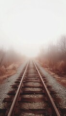 Fototapeta premium Misty Railway Track Evoking Mystery and Nostalgia with Soft Atmospheric Colors