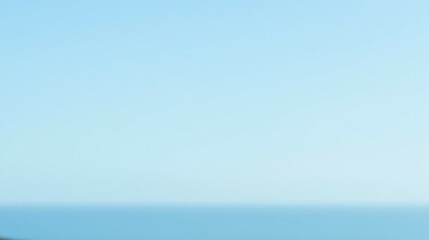 Fototapeta premium Serene Seascape with Clear Blue Sky and Tranquil Ocean View