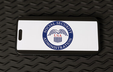 Social Security logo on a smartphone. The Social Security Administration oversees retirement, disability, and survivors benefits.