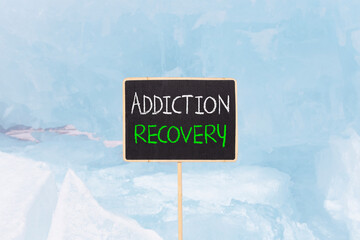 Addiction recovery symbol. Concept words Addiction recovery on beautiful black yellow blackboard....