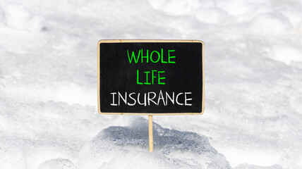 Whole life insurance symbol. Concept words Whole life insurance on beautiful black yellow blackboard. Beautiful white snow background. Business whole life insurance concept. Copy space.