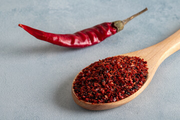 Red chili peppers.Red chili peppers in a wooden bowl on a bright background.Dried chili peppers