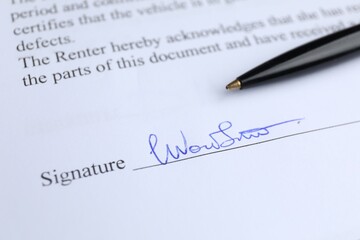 Ballpoint pen and signature on contract, closeup