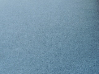 blue corduroy or velvet fabric, cozy and soft material of cold shade, design textile copy space fabric, graphic resource of cotton or thick clothes of deep blue color