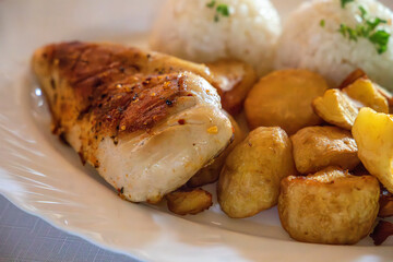 chicken breast with potatoes and rice