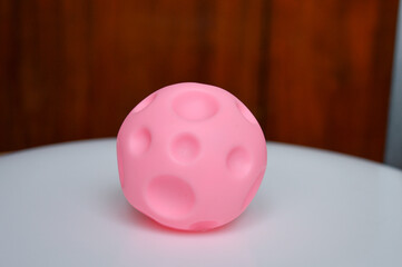 hand holding sensory textured ball babies toddlers tactile stimulation sensory play early childhood...
