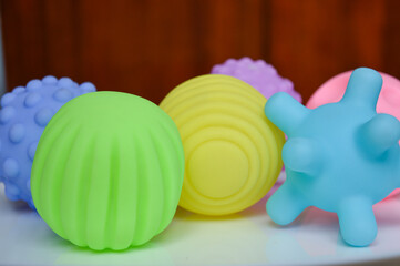 hand holding sensory textured ball babies toddlers tactile stimulation sensory play early childhood...