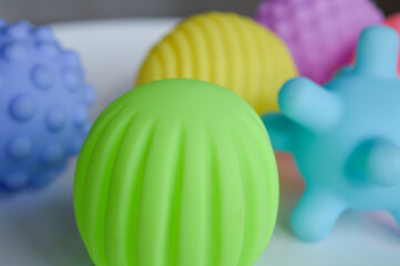hand holding sensory textured ball babies toddlers tactile stimulation sensory play early childhood...