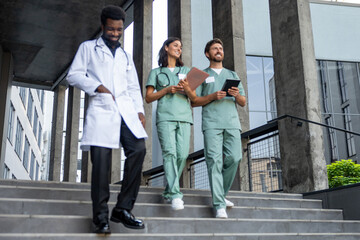 Obraz premium Group of doctors in lab coats feeling confident and looking determined