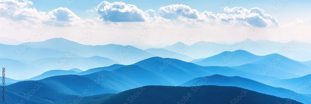 Poster majestic mountain range under soft clouds in a bright blue sky, perfect for inspirational quotes or 