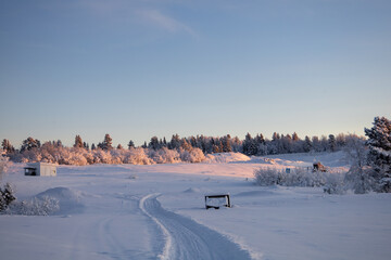 Fototapeta premium Snowy landscape winter scene in Swedish Lapland. Kiruna, Norrbotten County.