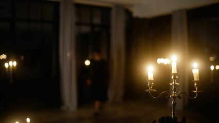 Passionate dancers performing tango in candlelit studio