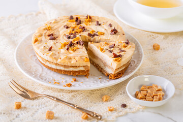 Saltet caramel cheesecake with cup of tea