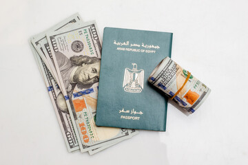 Egyptian Passport with Euro and US Dollars Banknotes, Migration Concept, on White Background